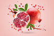 A ripe pomegranate with seeds and leaves flying in the air. Background with pomegranate fruit. Levitate. Pink. Fruit.