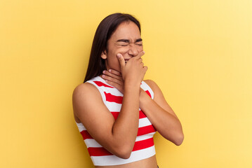 Wall Mural - Young mixed race woman isolated on yellow background suffers pain in throat due a virus or infection.