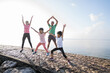© Odua Images - asian parent and children jumping up and down sport. healthy family stretching and exercise in the morning