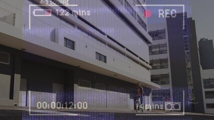 Poster - Animation of video recording interface, with woman cycling past modern building in the sun
