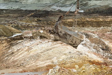 Wall Mural - large excavator loads rock with iron or bauxite mining bucket