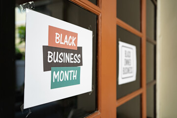 Canvas Print - black business month sign was attached on the window