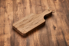 Cutting board on wooden table