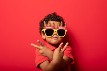 Cool Boy In Birthday Glasses On Red Background