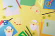 Children's creativity. Colored paper, scissors and stationery for making paper chicks