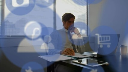 Poster - Animation of digital icons over businessman using laptop computer