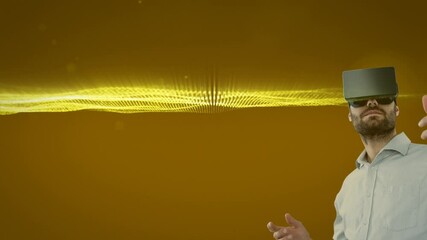 Poster - Caucasian man wearing vr headset against golden digital waves and light spots on yellow background