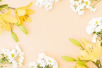 Wall Mural - flat lay frame with yellow lilies on color background
