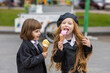 happy kids eating ice cream on the street