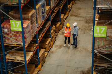 Wall Mural - Supervisor and employee working together in a warehouse