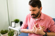 © AntonioDiaz - Latin man with suffering from a heart failure