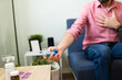 © AntonioDiaz - Hispanic man with asthma reaching for the inhaler