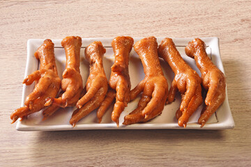 Wall Mural - Marinated chicken feet on a plate