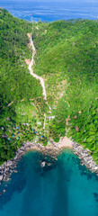 Wall Mural - Coastline in Southern Thailand aerial drone uav high altitude landscape over the sea and land and mountains with sunny weather and clouds with turquoise water and copy space