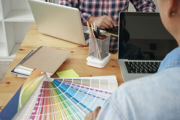 Fototapete - Graphic designer working on digital tablet. artist drawing on graphic tablet and Color swatch samples. Artist Creative Designer sketch graphic drawing creative creativity draw studying work on tablet