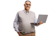 © Ljupco Smokovski - Happy mature man holding a laptop computer and looking at camera