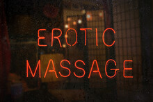 Vintage Neon Sign In Rainy Window Erotic Massage