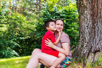 Wall Mural - mother and son having fun in nature