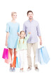 © Mediaphotos - Studio portrait of father, mother and their daughter standing together holding shopping bags, girl pointing finger at something, white background