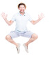 © Mediaphotos - Vertical full length side view portrait of cheerful handsome bearded Caucasian man wearing summer outfit jumping, white background