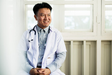 Wall Mural - An Asian doctor working at a hospital