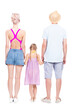 © Mediaphotos - Vertical full length studio portrait of family with one little daughter wearing summer outfits spending time on vacation, white background