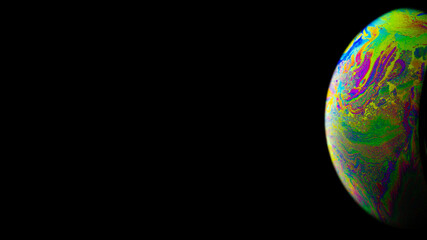 Wall Mural - Bubble color. Globe planet earth in galaxy universe space with abstract sun on black background. Color abstract fluorescent inks in water.