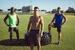 © Wavebreak Media - Portrait of diverse group of shirtless men exercising outdoors standing by tyre