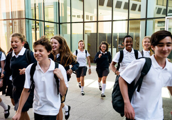 Wall Mural - group of students running at school