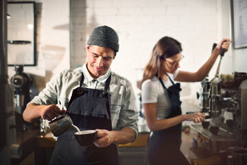 Canvas Print - Barista working in a coffee shop