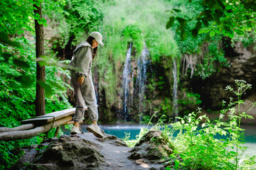 Poster - woman hiker enjoying view of waterfall