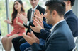 © Me studio - group of business people workshop training in business event at seminar room. business people applauding