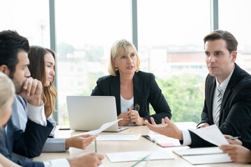 group of business people  working and disussing a project together at meeting room