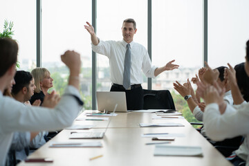 group of business people meeting and discussing a project at meeting room. business people applauding 