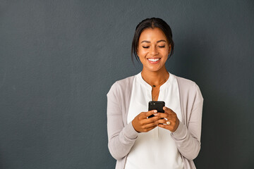 happy african american woman using smartphone