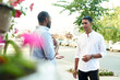 © etonastenka - Happy two multiracial male best friends talking while standing in the street, african guy talking to afghan buddy at outdoor meeting. Smiling multiethnic young people, multicultural friendship reunion