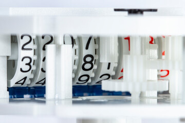 Mechanism and numbers of a water meter close-up, the concept of accounting for water consumption or the cost of utilities