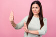 Photo of unhappy upset mature woman look empty space hold hand refuse isolated on pink color background