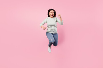 Poster - Full size photo of attractive excited happy lady jump up runner you isolated on pastel pink color background