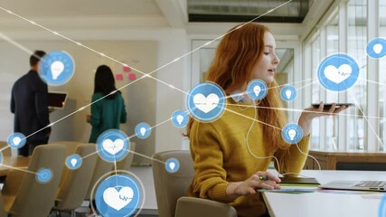 Sticker - Animation of network of digital icons over businesswoman using smartphone