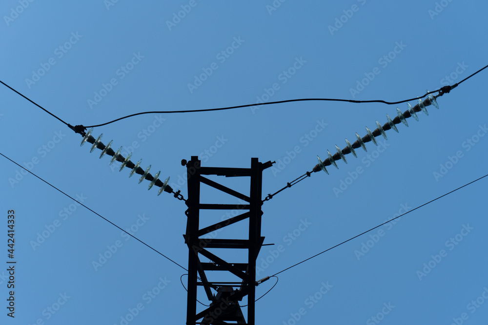 A rusted steel transmission tower in Ukraine supports high-voltage ...