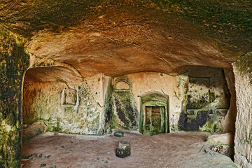 Wall Mural - Matera, Basilicata, Italy: interior of an old cave house carved into the tufa rock in the old town (sassi di Matera)