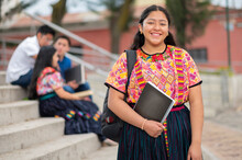 Portrait Of An Indigenous College Student With Books In Hands In The University.