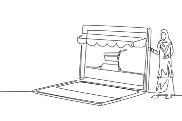 Poster - Continuous one line drawing young Arab woman inserting credit card into canopy laptop screen with shopping cart. E-shop, digital payment concept. Single line draw design vector graphic illustration