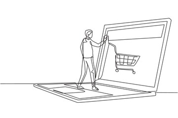 Wall Mural - Single continuous line drawing young male shopping online via giant laptop screen with shopping cart inside. Sale, digital lifestyle concept. Dynamic one line draw graphic design vector illustration