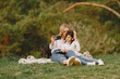 © prostooleh - Elegant mother with daughter in a summer forest