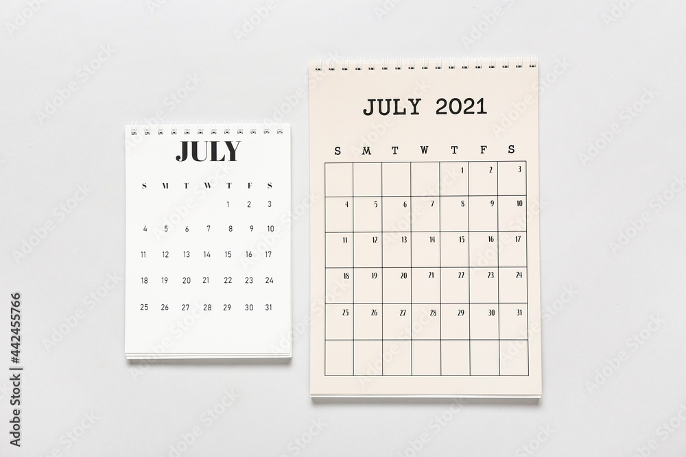 Flip paper calendars on light background