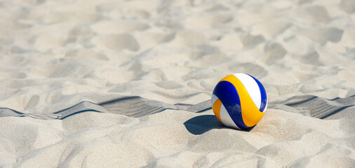 Beach volleyball ball on the sand beach. Team sport concept