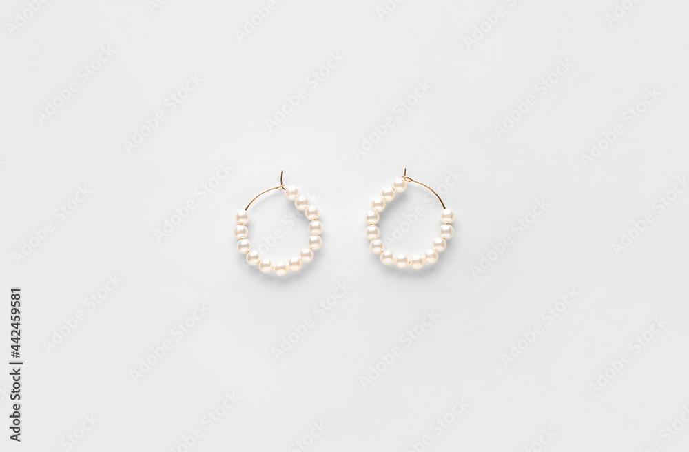 Beautiful earrings on white background