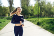 © fotofabrika - Athletic fit young woman jogging early in the morning in park